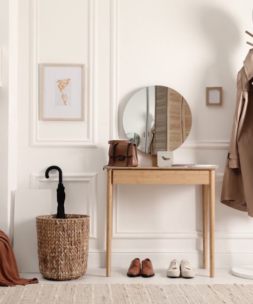 Modern hallway interior with stylish dressing table and key holder
